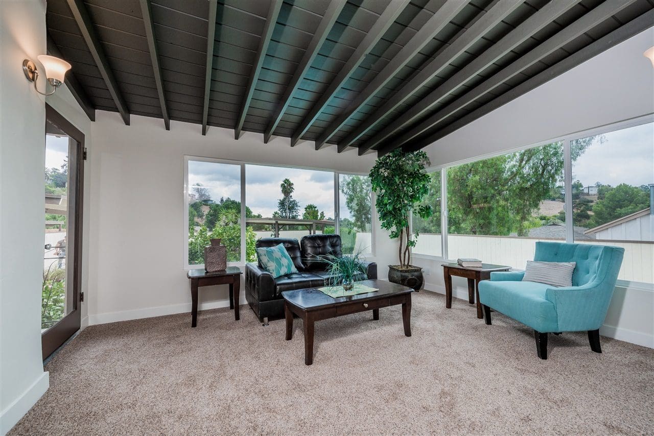 A living room with couches and tables in it